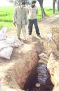 Officials inspect the site from where the oil was pilfered in Kurukshetra 