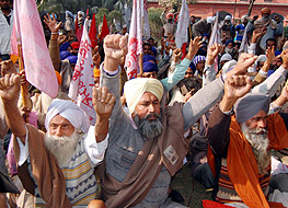 Farmers hold a dharna in favour of their demands at the Deputy Commissioners office in Amritsar on Wednesday. Photo: Vishal Kumar