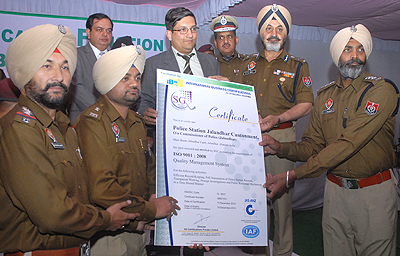 DGP P.S. Gill hands over the ISO 9001:2008 certificate to officers of Jalandhar Cantonment police station in Jalandhar on Wednesday. Tribune photo: Malkiat Singh