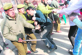 Members of the Jammu and Kashmir Physiotherapists Association clash with the police in Jammu on Wednesday. 