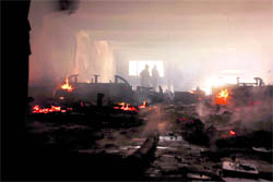 Inside view of a furniture shop near the bus stand which caught fire