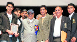 Haryana Chief Minister Bhupinder Singh Hooda with Commonwealth Games and Asian Games medal winners in Panchkula on Wednesday