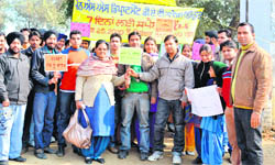 NSS volunteers of DAV College organise a rally at Government Elementary School at Tirathpur village in Amritsar.