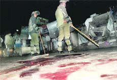 The site where the blast occurred; and (bottom) a grieving family at General Hospital, Sector 6, on Friday. 