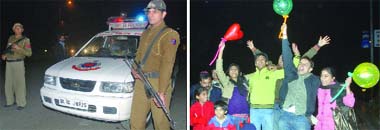 Delhi police keeps a vigil during the New Year celebrations. Youngsters hail the year at Connaught Place in New Delhi