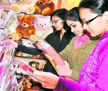 Girls buy New Year cards at a shop in Haridwar on Friday