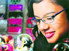 A girl looks at a New Year gift in Haridwar on Friday