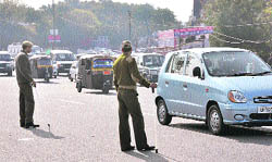 Policemen man traffic on the eve of New Year in Jammu on Friday