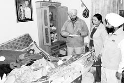 Police inspects the spot where theft took place at a house in Vasant Vihar, Phase II, Zirakpur, on Saturday