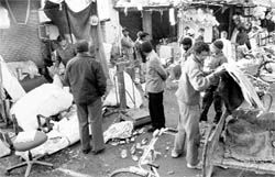 Scrap dealers doing their ususal business outside their closed shops at Buddanpur village in Panchkula on Saturday