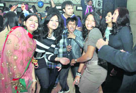 Youngsters dance their way into 2011 in Dehradun on Friday night.