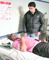 Sudhir Mudgal donates blood at a hospital in Ludhiana.