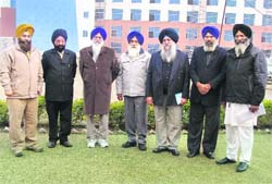 SGPC president Avtar Singh Makkar (third from left) outside the World Sikh University building at Fatehgarh Sahib on Saturday. 