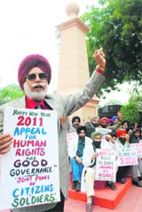 Citizens hold a protest against corruption in Patiala on Saturday