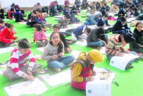 Children take part in a painting contest on the inaugural day of the road safety week at Children Traffic Park, Sector 23, in Chandigarh