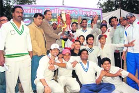 The Himalayan Cricket Academy team with the Inter-district T20 Cricket Tournament trophy in Dehradun