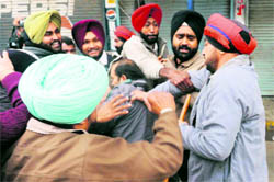 Cops prevent members of the Paramedical Contractual Employees Union from heading towards the Health Ministers residence in Amritsar on Sunday. 
