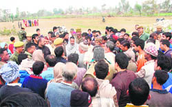 Villagers narrate an incident to the police following a clash in the Domana area in Jammu