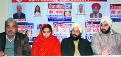 Parents of Khushpreet (centre) during a press conference at YMCA, Sector 11, Chandigarh, on Monday.