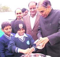 Pawan Kumar Bansal, Union Minister for Parliamentary Affairs and Water Resources, inaugurates a sanitation programme at Sector 26, Chandigarh.