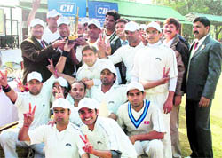 The team of Akum Drugs, Haridwar, with the CII Uttarakhand Cricket Cup in Dehradun