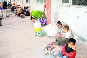 A homeless family takes shelter at the Rohtak railway station