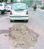 The caved-in portion of the Mall Road that was plugged late on Monday evening.
