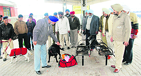 Cops check bags of passengers at the railway station in Ludhiana on Monday.
