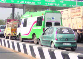 An ambulance seen stuck up at tax toll plaza in Kurali. A Tribune photograph