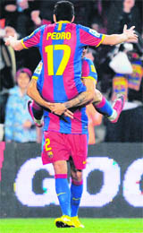 Barcelona's forward Pedro Rodriguez and defender Daniel Alves da Silva celebrate after scoring a goal during the Spanish League match against Levante at Camp Nou stadium in Barcelona on Sunday.