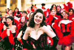 Kimberley Dunne and other burlesque enthusiasts pose in front of the National Gallery in central London's Trafalgar Square, during a world record attempt to break what they called the world's largest burlesque dance on Monday