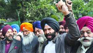 Activists of the Shiromani Akali Dal (Badal) protest against Union minister Ajay Maken in New Delhi on Wednesday.