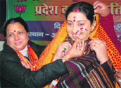Smriti Irani, National President of the BJP Mahila Morcha, being presented a Kumaoni nose ring at a state-level convention of the Uttarakhand BJP Women Cell in Dehradun