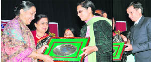 Uttarakhand Governor Margaret Alva honours Jyotsna, a probationary officer in a bank at Gaya; and (right) Ajay Prasad Dhanak, assistant manager, Dr Reddys Laboratory, at a function to honour visually handicapped persons in Dehradun 