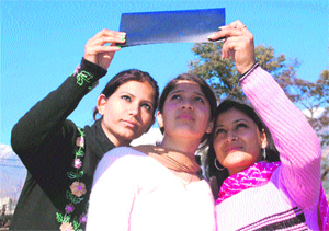Sun-gaze: Students of a PG college watch the solar eclipse in Dharamsala on Tuesday. 