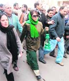 PDP president Mehbooba Mufti carries a lantern while leading a procession against power shortage in Srinagar on Tuesday