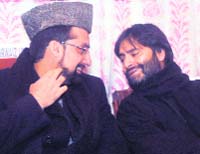 Hurriyat Conference leader Mirwaiz Umar Farooq and JKLF chairman Yasin Malik at a seminar in Srinagar on Tuesday.