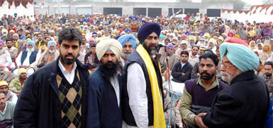 Manpreet Singh Badal along his father Gurdas Badal during his address to a gathering at the Roranwali village in the Lambi Assembly constituency of Muktsar district on Wednesday.