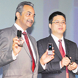 Wenxue Zhang (R), President of GFive International Limited, with Arshit Pathak, MD, Kingtech Electronics India Pvt Ltd., at the launch of new range of companys mobile phones in New Delhi on Wednesday. The phones are priced between Rs 1,500 and Rs 6,000.