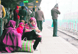 Passengers wait for trains at the Chandigarh Railway Station on Wednesday.