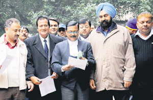 Independent mayoral candidate JS Kang, along with BJP senior leaders, on their way to file a plea at the DC office in Sector 17, Chandigarh, on Wednesday.