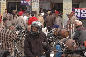 Residents queue up out side an LPG agency to refill their cylinders at Ambala Cantonment. 