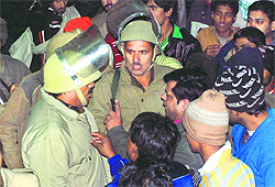 Protesters put their point of view across to policemen.