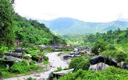 A slum on the banks of a river near Dehradun