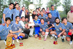 The Eleven Star team that won the haheed Khadag Bahadur Memorial Football Tournament pose with their trophies in Dehradun on Wednesday