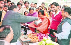 BJP activists sell vegetables at affordable prices to highlight Centres inability to control inflation, in Haridwar