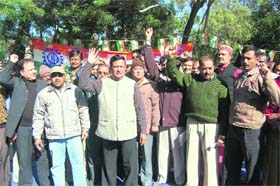 Workers of INTUC hold a protest at the Gandhi Park in Dehradun