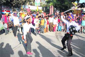 Sikh youngsters perform gatka during a procession in Dehradun