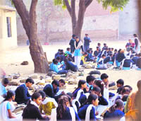 Students sit on jute mats at Government School, Etmadpur, in Faridabad