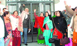 Teachers of the Rajiv Gandhi College for Women, Bhiwani, stage a demonstration against the Principal 